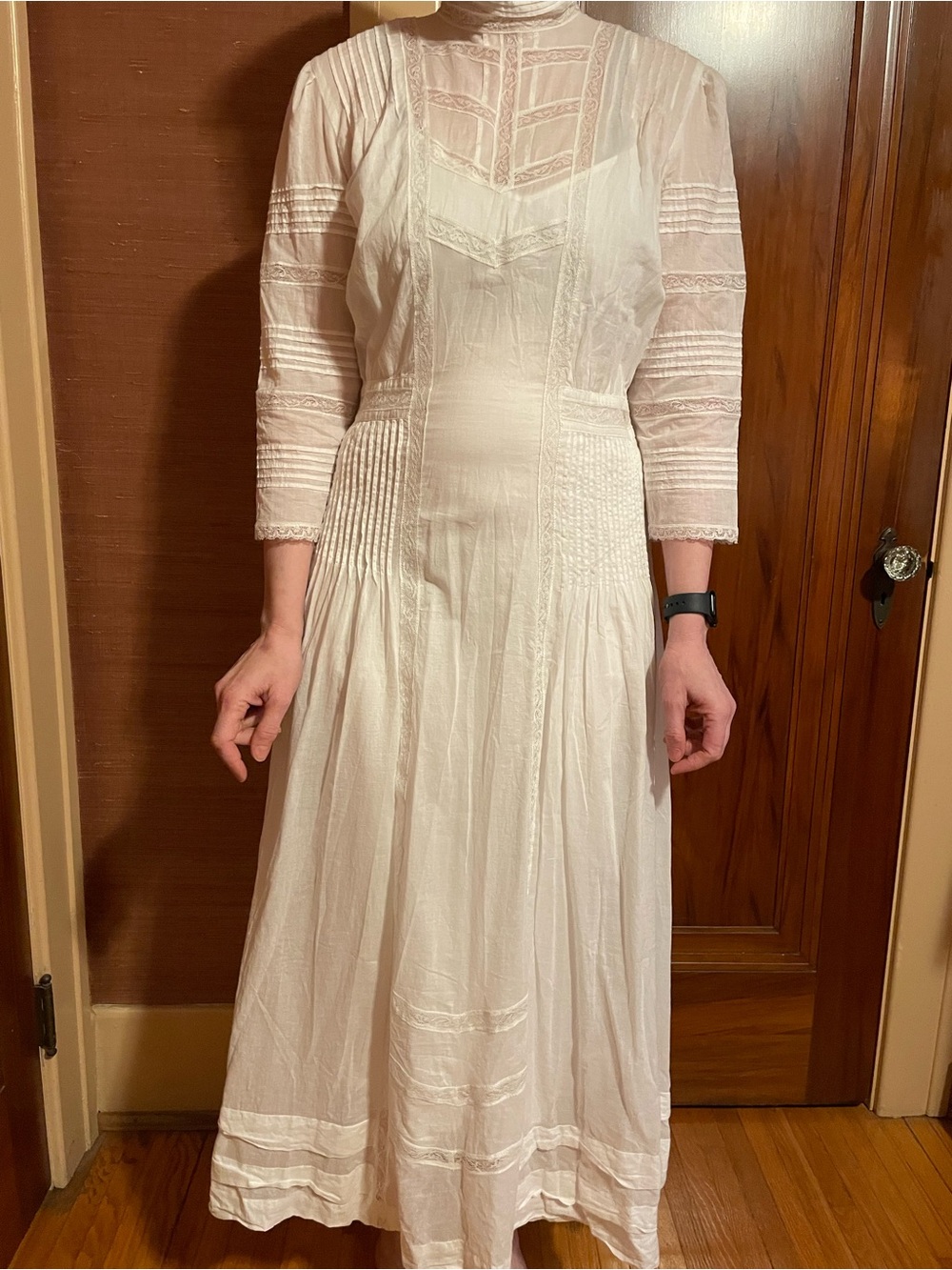 Edwardian-style tea dress in crisp white cotton. Features intricate pintuck